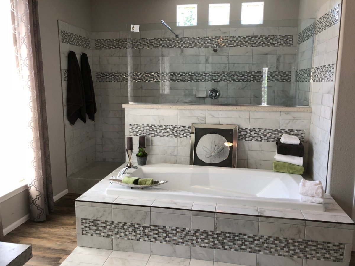 <h2>Custom Bathrooms</h2>  <p>Homes Direct designs their homes with multiple bathrooms. You could opt for a luxurious master bathroom with ample vanity space, walk-in closets and an oversized tub all your own.</p>  <p><a https://www.thehomesdirect.com/customization/bathroom